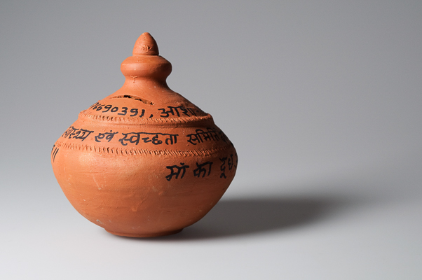 A clay coin bank from India